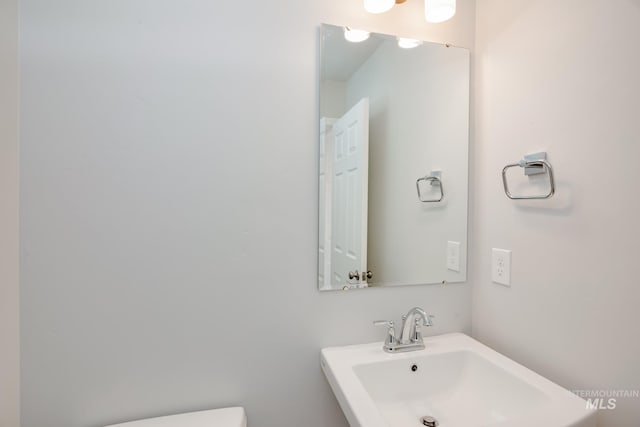 bathroom with toilet and sink