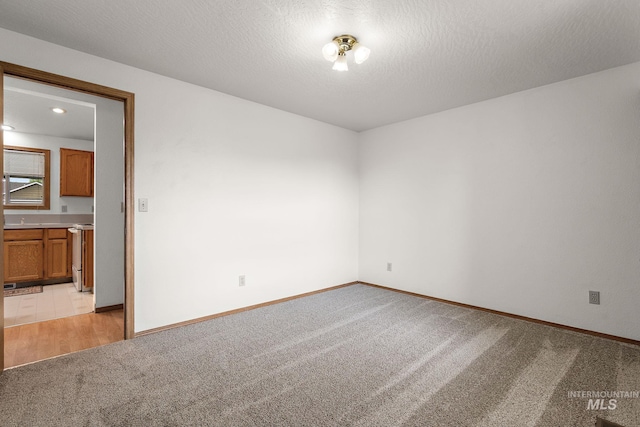607 S State, Nampa, ID 83686 - spare room featuring light colored carpet, baseboards, and recessed lighting
