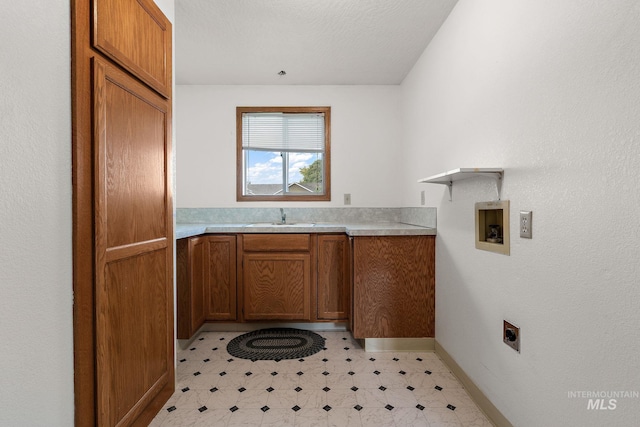 607 S State, Nampa, ID 83686 - laundry room featuring light flooring, cabinet space, hookup for an electric dryer, hookup for a washing machine, and baseboards