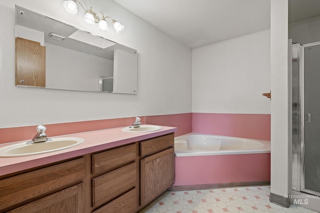 607 S State, Nampa, ID 83686 - bathroom with a stall shower, double vanity, and a garden tub
