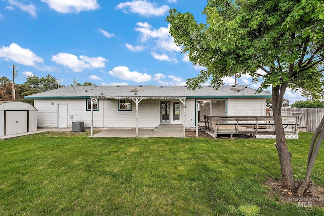607 S State, Nampa, ID 83686 - rear view of house with a patio area and central AC