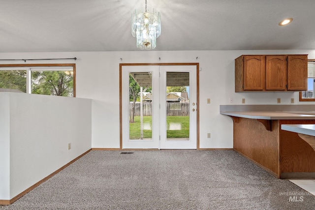 607 S State, Nampa, ID 83686 - unfurnished dining area with baseboards, carpet, a chandelier, and recessed lighting