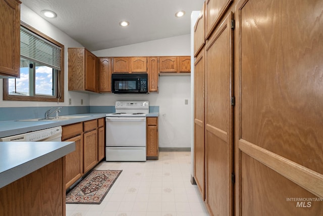 607 S State, Nampa, ID 83686 - kitchen featuring black microwave, white range with electric cooktop, brown cabinets, lofted ceiling, and recessed lighting