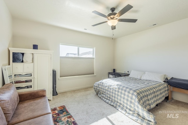 carpeted bedroom featuring ceiling fan