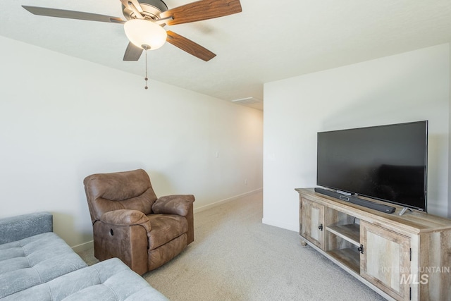 carpeted living room featuring ceiling fan