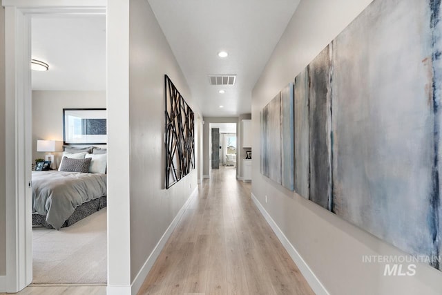 corridor featuring light hardwood / wood-style flooring