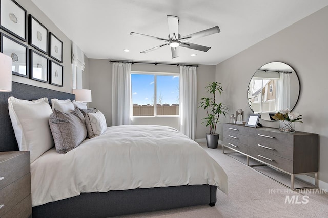 carpeted bedroom with ceiling fan