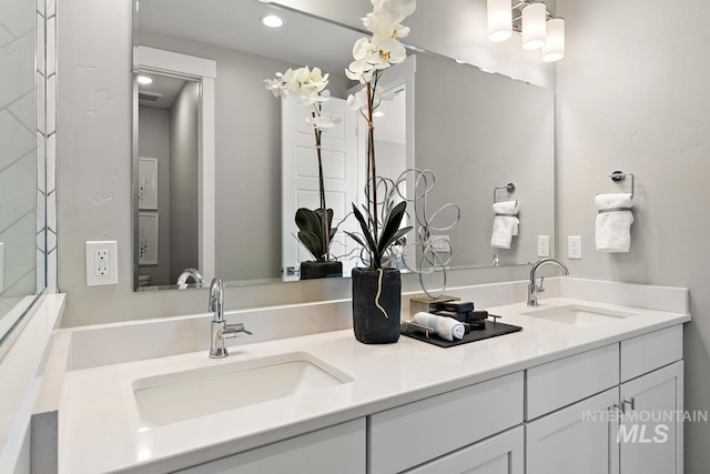 bathroom featuring dual vanity