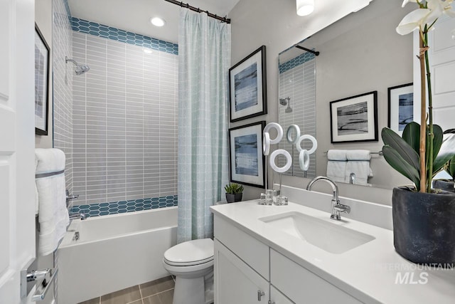 full bathroom with shower / bath combo, toilet, tile patterned floors, and vanity