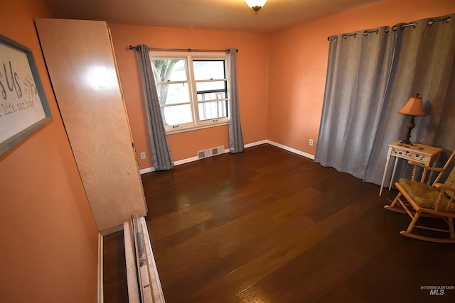 123 15th Ave, Lewiston, ID 83501 - unfurnished room with dark wood-style flooring and baseboards