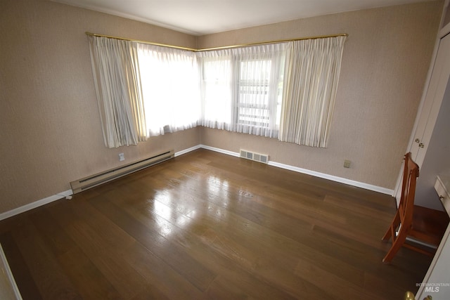 123 15th Ave, Lewiston, ID 83501 - unfurnished room with a baseboard radiator, wood finished floors, and baseboards
