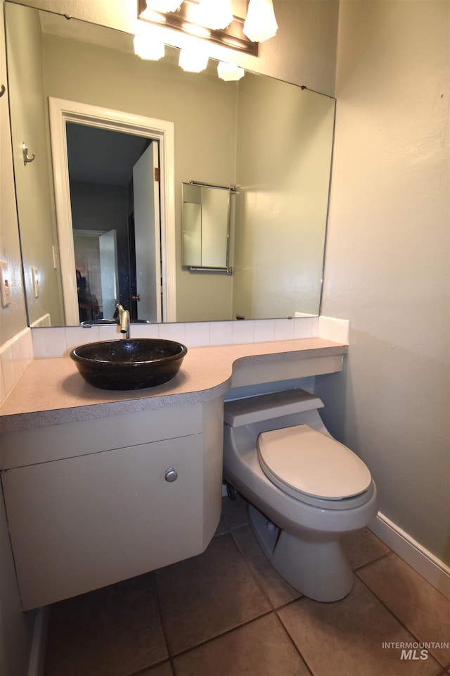 123 15th Ave, Lewiston, ID 83501 - bathroom with tile patterned flooring, toilet, and vanity