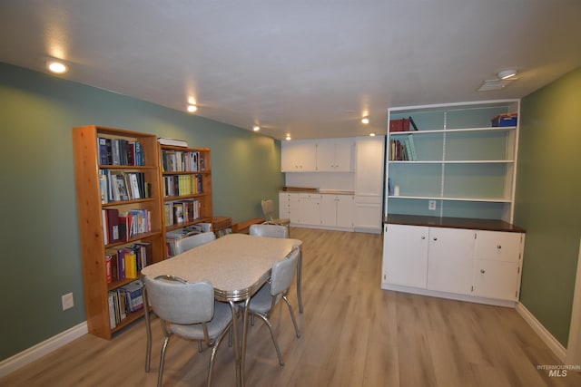 123 15th Ave, Lewiston, ID 83501 - dining area with light wood-style flooring and baseboards