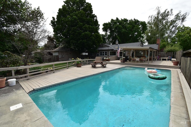 123 15th Ave, Lewiston, ID 83501 - view of pool with a wooden deck and a fenced backyard