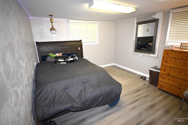 123 15th Ave, Lewiston, ID 83501 - bedroom with wood finished floors, baseboards, and ornamental molding