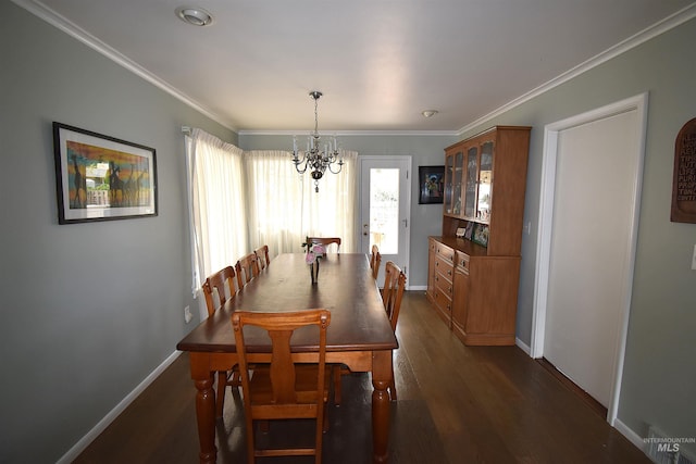 123 15th Ave, Lewiston, ID 83501 - dining area with a chandelier, baseboards, dark wood-type flooring, and ornamental molding