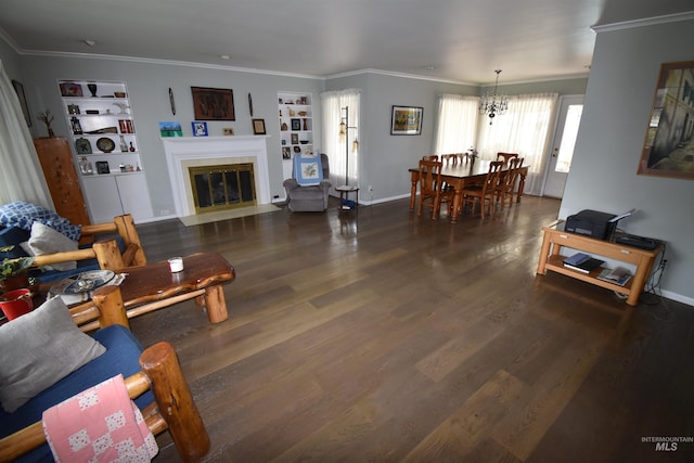 123 15th Ave, Lewiston, ID 83501 - living room featuring built in features, wood finished floors, crown molding, and a chandelier
