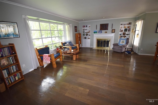 123 15th Ave, Lewiston, ID 83501 - living area featuring wood finished floors, a fireplace with flush hearth, built in shelves, ornamental molding, and baseboards