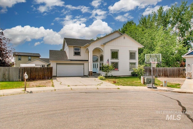 10539 W Merab Ct, Star, ID 83669 - view of front of house with concrete driveway, an attached garage, and board and batten siding