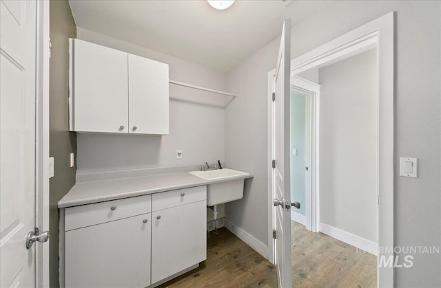 10539 W Merab Ct, Star, ID 83669 - laundry area with light wood finished floors and baseboards