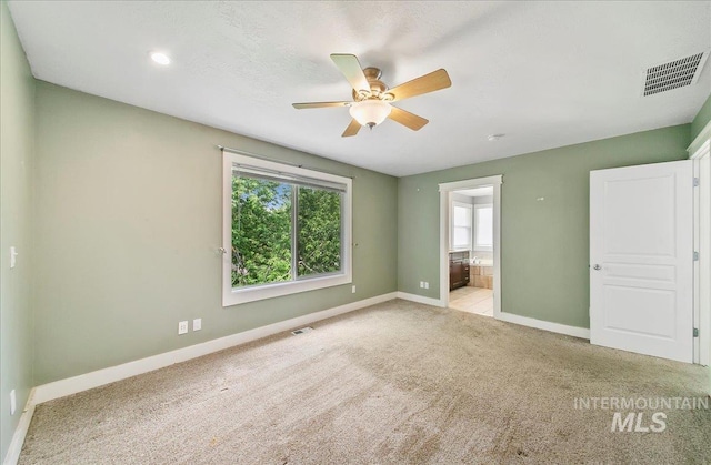 10539 W Merab Ct, Star, ID 83669 - unfurnished bedroom featuring carpet flooring, connected bathroom, and ceiling fan