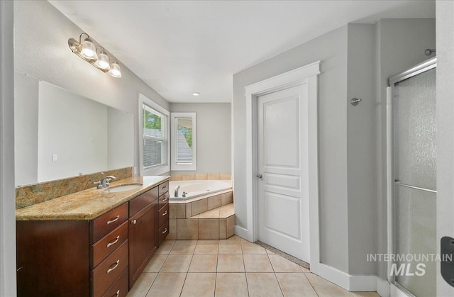 10539 W Merab Ct, Star, ID 83669 - full bath with a garden tub, vanity, tile patterned flooring, and a shower stall