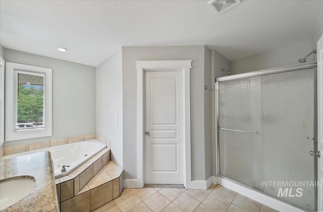 10539 W Merab Ct, Star, ID 83669 - full bath featuring a stall shower, a bath, tile patterned flooring, and recessed lighting