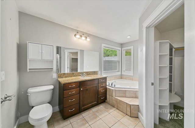 10539 W Merab Ct, Star, ID 83669 - bathroom with a bath, vanity, tile patterned flooring, and a spacious closet