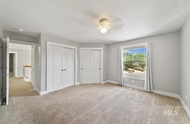 10539 W Merab Ct, Star, ID 83669 - unfurnished bedroom featuring carpet flooring and two closets