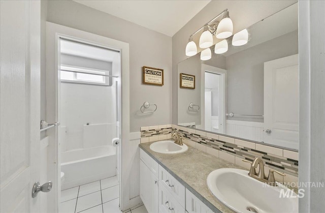 10539 W Merab Ct, Star, ID 83669 - bathroom featuring double vanity, tile patterned floors, and tasteful backsplash