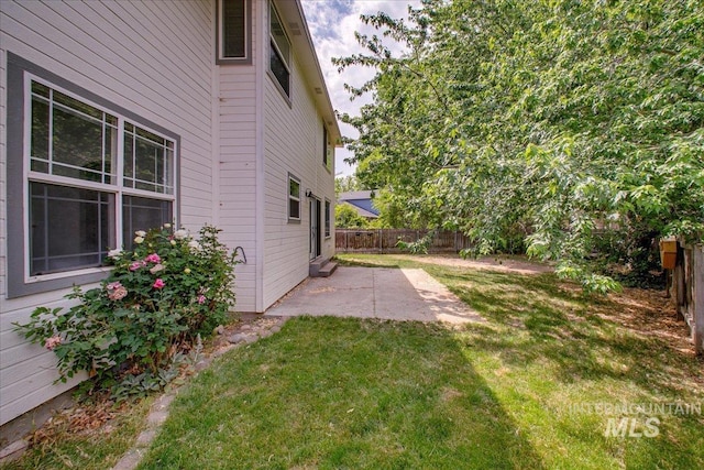 10539 W Merab Ct, Star, ID 83669 - fenced backyard with a patio area