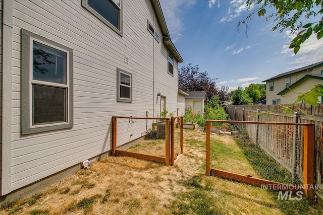 10539 W Merab Ct, Star, ID 83669 - fenced backyard featuring a vegetable garden