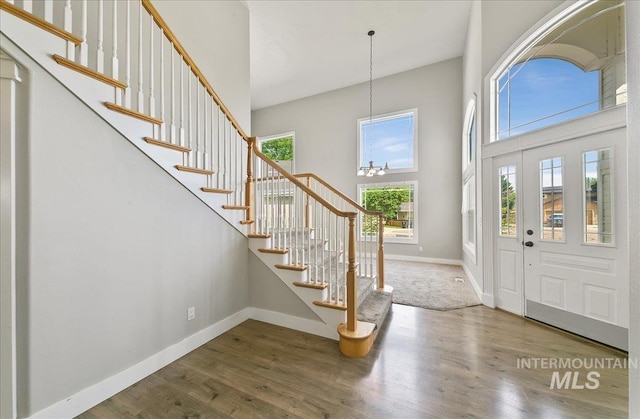 10539 W Merab Ct, Star, ID 83669 - entrance foyer with a towering ceiling, wood finished floors, and stairs