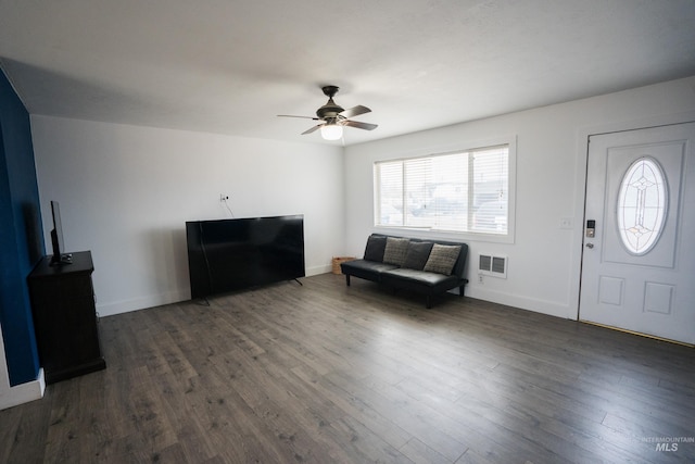 entryway with dark wood-type flooring, visible vents, and baseboards