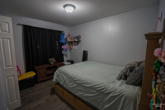 bedroom with wood finished floors