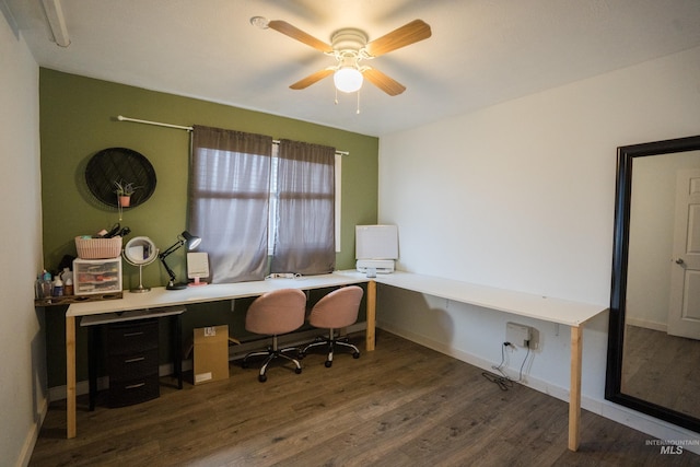 office featuring a ceiling fan, baseboards, and wood finished floors