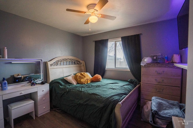 bedroom featuring a ceiling fan and wood finished floors