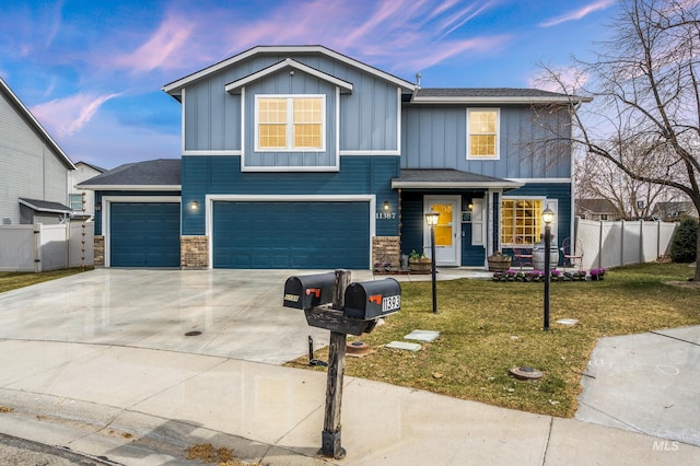 view of front of house featuring board and batten siding, concrete driveway, a garage, and fence