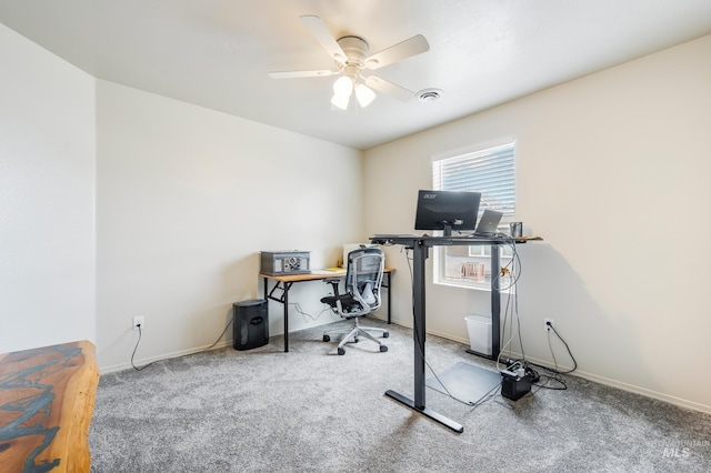 office space featuring carpet flooring, visible vents, baseboards, and ceiling fan