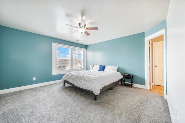 bedroom with baseboards, carpet floors, and ceiling fan