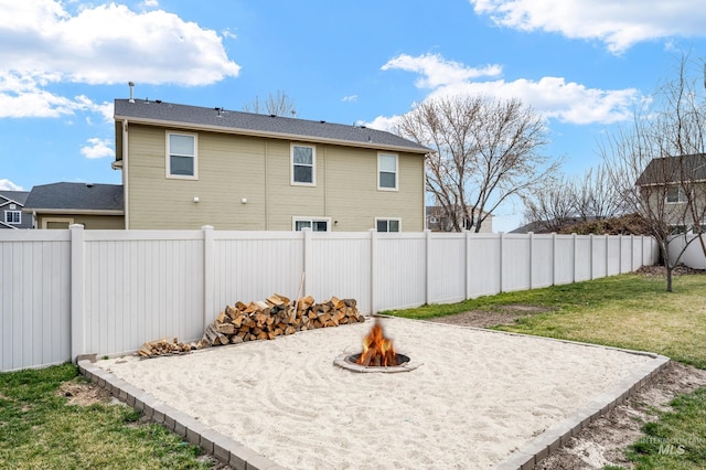 exterior space featuring a patio, an outdoor fire pit, and a fenced backyard