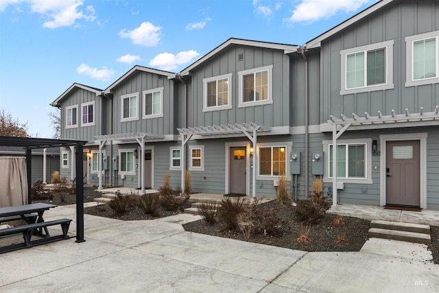 1218 W Ivywild St, Boise, ID 83706 - view of front facade with a pergola, board and batten siding, and a patio area