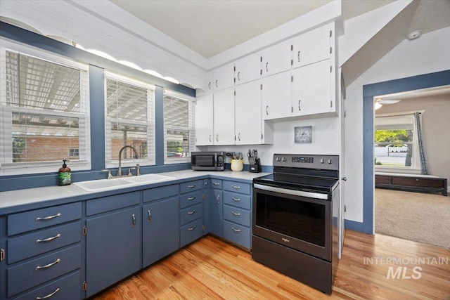 720 E Center St, Kimberly, ID 83341 - kitchen featuring stainless steel appliances, a sink, white cabinetry, and light countertops