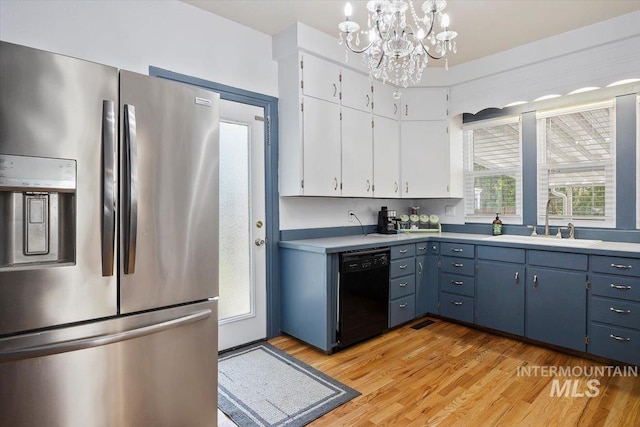 720 E Center St, Kimberly, ID 83341 - kitchen featuring stainless steel fridge, dishwasher, a sink, a chandelier, and light wood-type flooring