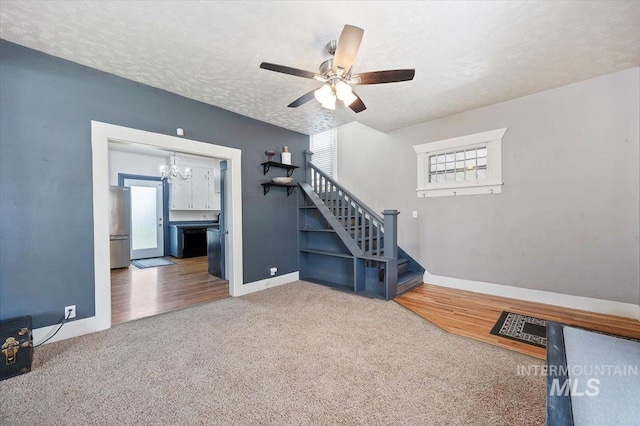 720 E Center St, Kimberly, ID 83341 - stairway with healthy amount of natural light, carpet floors, baseboards, and a textured ceiling