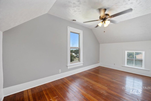 720 E Center St, Kimberly, ID 83341 - bonus room with vaulted ceiling, hardwood / wood-style floors, a ceiling fan, healthy amount of natural light, and baseboards