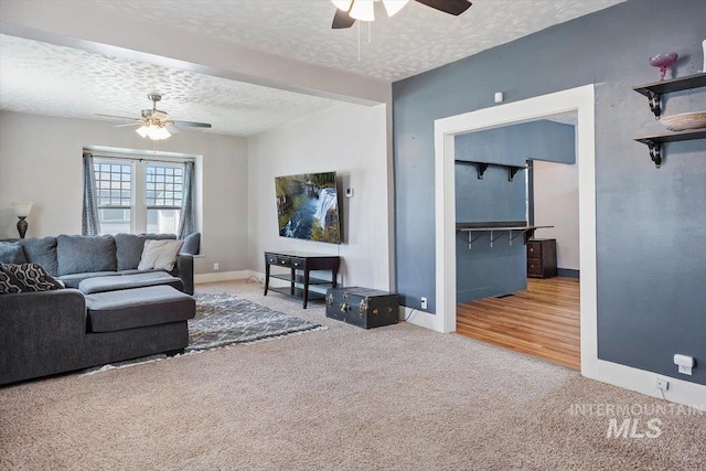 720 E Center St, Kimberly, ID 83341 - carpeted living area with a ceiling fan, a textured ceiling, and baseboards