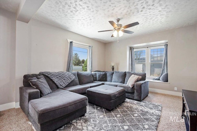 720 E Center St, Kimberly, ID 83341 - carpeted living room with ceiling fan, baseboards, and a textured ceiling