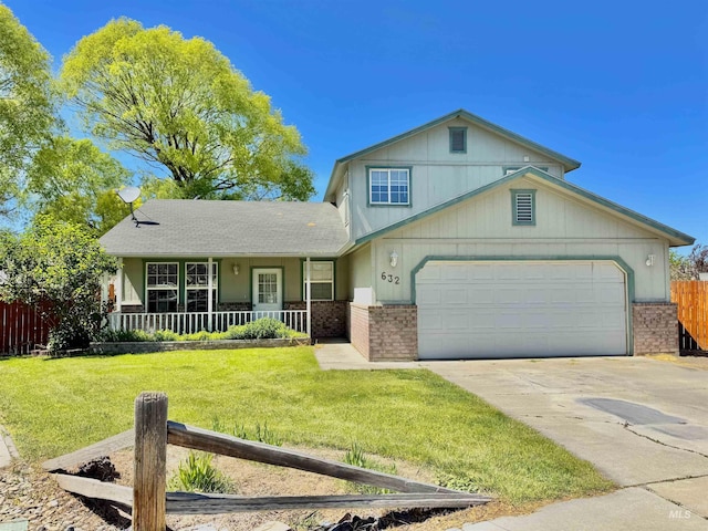 632 Caitlin Ave, Twin Falls, ID 83301 - view of front of house featuring brick siding, a porch, driveway, and a garage