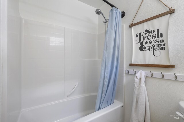bathroom featuring shower / bath combination with curtain